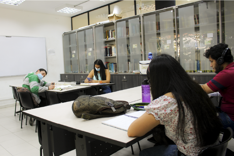 The School of Mathematics invites you to get to know the Teachers' Office, which is at the disposal of its students and the educational community. Photo taken at the CEMAT Study Center, general view of the room with some students working at their desks.