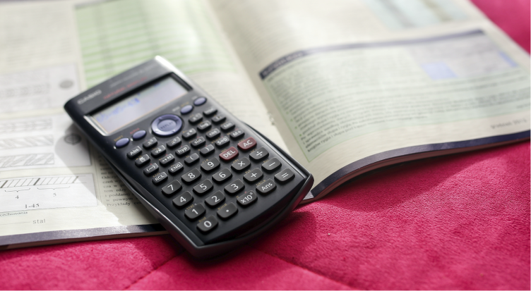The School of Physics UIS presents to the educational community and the general public the outreach services of its Relativity and Gravitation Research Group (GIRG). Photo taken from stock images showing a scientific calculator on a book.